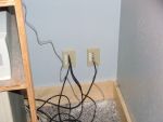 Communication jacks behind computer desk