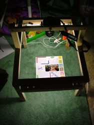 This is the rig I use to photograph the scrapbook pages with my Canon Rebel XTi.  It's basically just a wooden frame with two 18 inch fluorescent lights on it for even lighting.